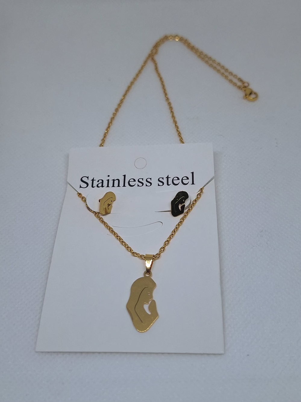 Gold Stainless Steel Silhouette Pendant Necklace and Earring Set